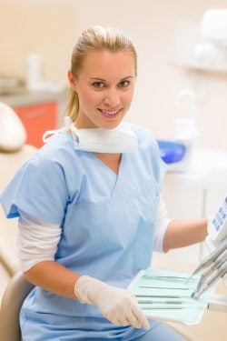 smiling dental assistant at dental office